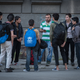 A man arranges transportation for a group of unaccompanied minors, who make up a sizeable percentage of asylum-seekers passing through Belgrade.